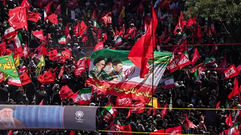 Newshour, Newshour, Crowds gather for burial of Iran's assassinated Supreme Leader