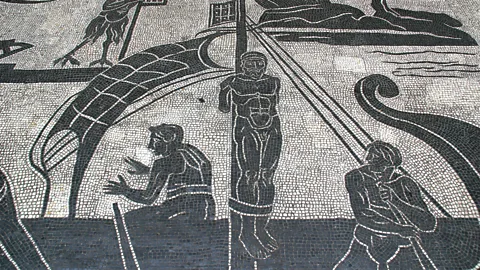 A black-and-white mosaic showing the Greek hero Odysseus tied to a ship mast (Credit: Getty Images)