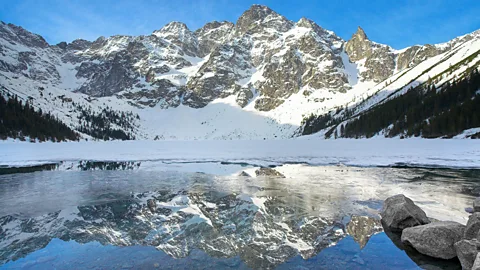 Morskie Oko in the Tatra Mountains of southern Poland, with its peaks reflected in a lake below it (Credit: Alamy)