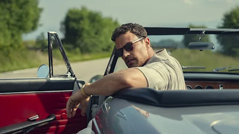 Theo James sitting in a convertible in The Gentlemen (Credit: Netflix)