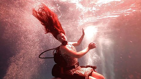 The woman making her wheelchair scuba-dives into art