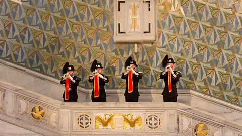 Guards blow their horns at the opening of the Nobel Peace Prize lecture at Olso City Hall. (AP Photo/Markus Schreiber)