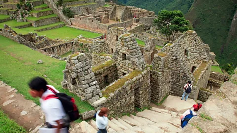 Machu Picchu sits perched atop a mountain overlooking the Urubamba Valley in Peru.