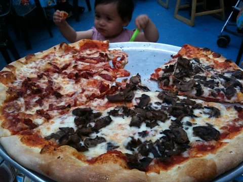 Pizza: a legendary part of the American experience for young and old alike. (Robert Reid)
