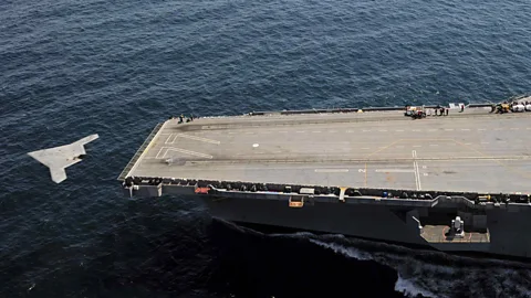 US Navy/Reuters An X-47B drone makes aviation history by becoming the first unmanned aircraft to take off from a carrier after flying from the USS George H W Bush. (Copyright: US Navy/Reuters)