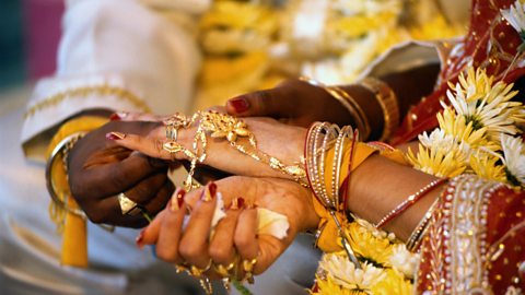 Placing a ring on the bride's finger at a Hindu wedding