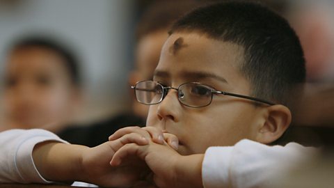  Child at Ash Wednesday ceremony, USA