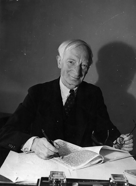 Lord Beveridge working at his desk