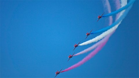 Clear blue sky with The Royal Air Force Red Arrows Aerobatic Display Team