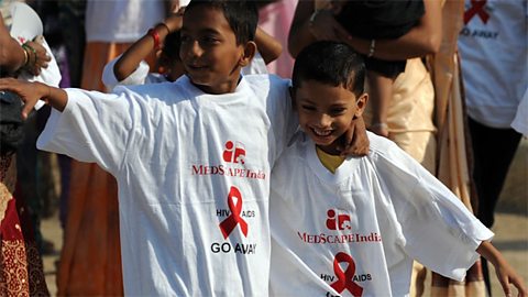 Indian schoolchildren arrive for a rally in Mumbai on World AIDS Day
                  