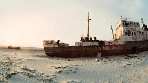 Abandoned ships sit on the sand, where the Aral Sea once was. (Victor Vasenin/Getty Images).
