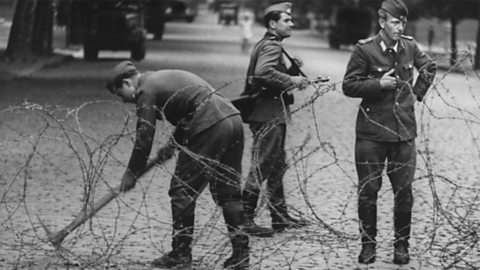 East German soldiers closing the border of East and West Berlin