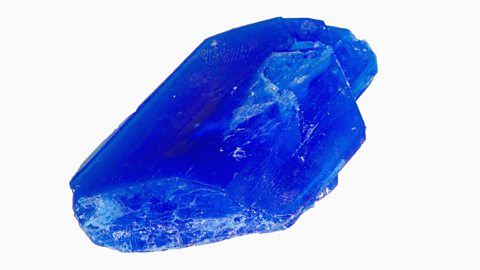 Copper sulfate forms blue crystals