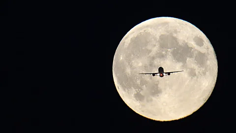 Reuters A jet is silhouetted against the ‘harvest Moon’ near London's Heathrow Airport. The term is used to describe the full Moon closest to the autumn Equinox. (Copyright: Reuters)