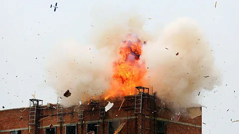 Reuters A bomb dropped by a drone explodes on the roof of a building in Foshan, Guangdong province in China, during a military drill. (Copyright: Reuters)
