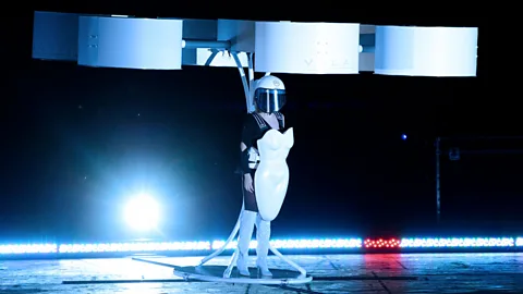 Lady Gaga demonstrates the Volantis prototype, which she called the world's first "flying dress", to promote her new album. (AP)