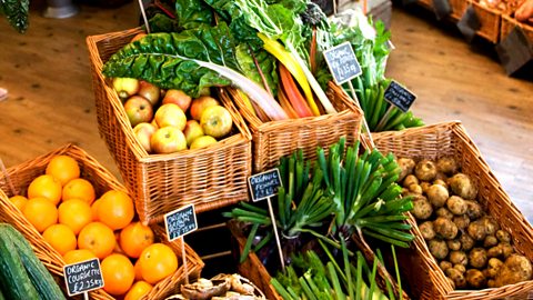 Fruit and vegetables in boxes in a shop