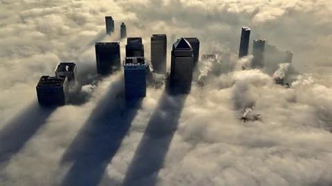 Skyscrapers in London’s financial district loom above morning fog in December, taken from a police helicopter. (Metropolitan Police)