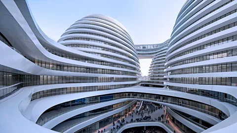 Critics praised Zaha Hadid's Galaxy Soho project in Beijing for its futuristic curves but a Beijing heritage group mourned the continued destruction of its old town. (Hufton Crow)