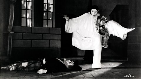 Etienne Decroux and Jean-Louis Barrault performing on stage as pierrot clowns, 1945