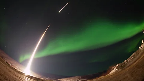 A Nasa rocket is launched into an aurora over the Alaskan village of Venetie. The rocket’s mission was to investigate “curls” – patterns showing magnetic activity. (Nasa/Reuters)