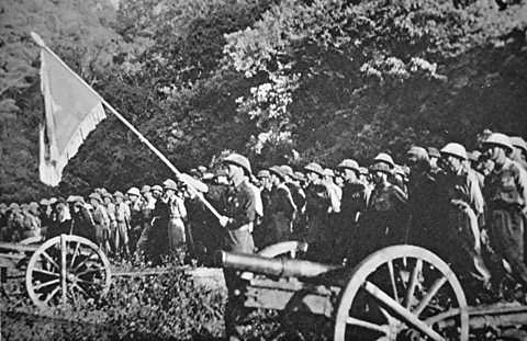 Rows of soldiers stand at attention