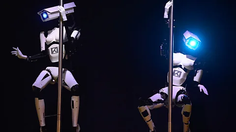 Two robots perform a cheeky pole dance on the eve of the CeBIT Technology Trade Fair in Hanover, Germany. (AFP/Getty Images)