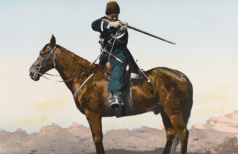 Cossack soldier on horseback aiming rifle