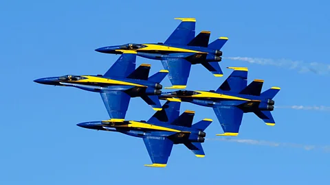 Four F/A-18s of the US Navy Blue Angels display team perform a close-formation aerobatics stunt during an air show in El Centro, California. (Imperial Valley Press/AP)