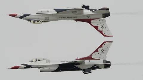 Two F-16s of the US Air Force Thunderbirds display team perform a hair-raising manoeuvre during an airshow at the Columbus Air Force Base in Columbus, Missouri. (AL.com/AP)