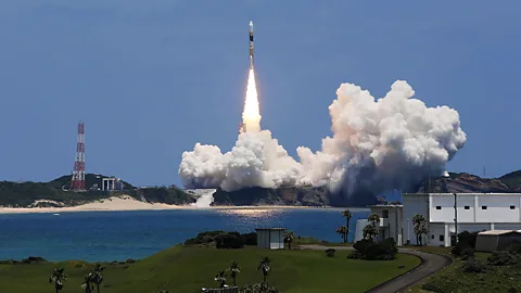 Japan's H-IIA rocket lifts off from a space centre on the island of Tanegashima to deploy a new mapping satellite for surveying natural disaster damage. (AFP/Getty Images)