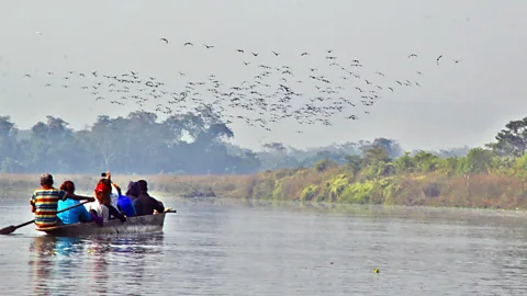 A canoe ride down the Rapti River at dawn. (Nellie Huang)