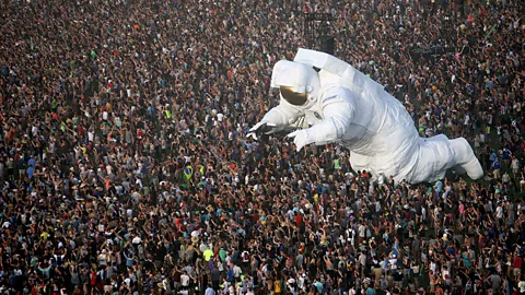 The giant inflated astronaut art work, Escape Velocity, is surrounded by music fans at the Coachella Valley Music & Arts Festival, 2014
(David McNew/AFP/Getty Images)