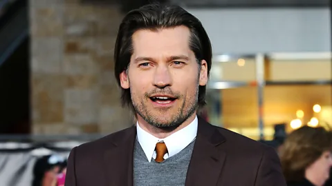 A brown tie, such as actor Nikolaj Coster-Waldau's, can come across as friendly. (Jason LaVeris/GettyImages)