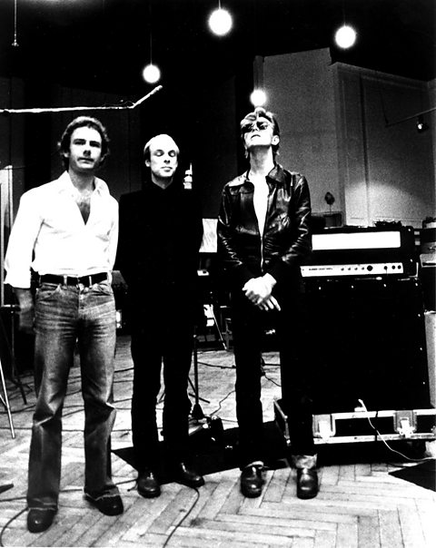 Robert Fripp, Brian Eno and David Bowie pose for a portrait