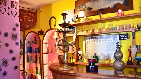The bar in La Sebastiana is filled with antique glassware from around the world. Neruda kept his favourite whiskeys in a chest. He also collected bottles of wine. (Dave Seminara)