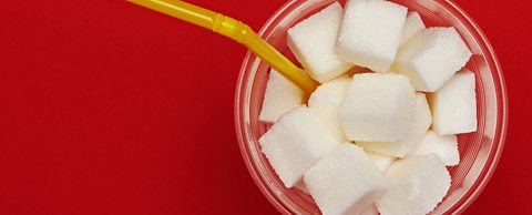 Sugar cubes in a glass