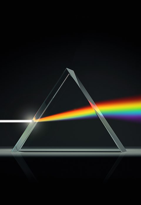 A prism refracting a beam of light. 