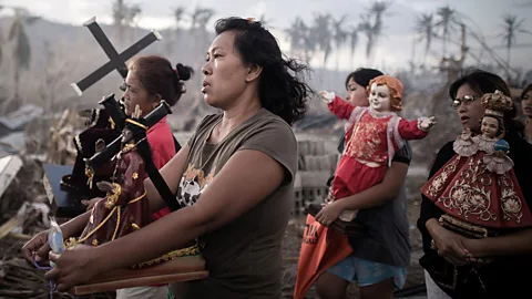 In the Philippines, survivors of Super Typhoon Haiyan march during a religious procession (Getty Images)