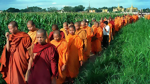 Buddhist monks file towards a ceremony at Sampov Treileak pagoda in Cambodia (Getty Images)
