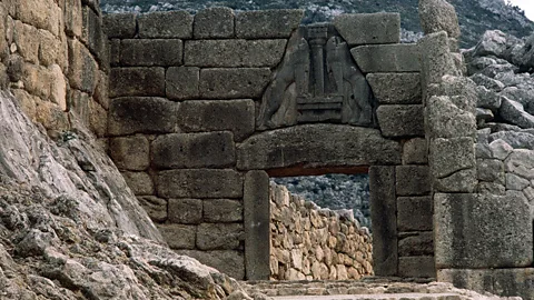 Lions or griffins? The stone beasts that flank the entrance to citadel of Mycenae have lost their heads – so we cannot be sure (De Agostini/Getty Images)