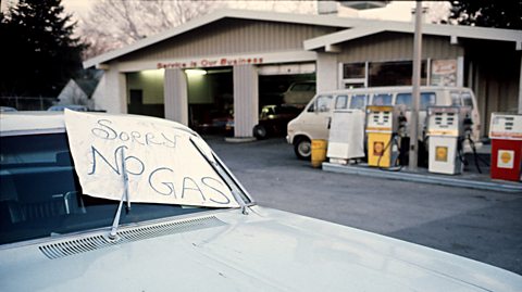 A gas station in America during the 1973 oil crisis. A sign saying "sorry no gas" is visible. 