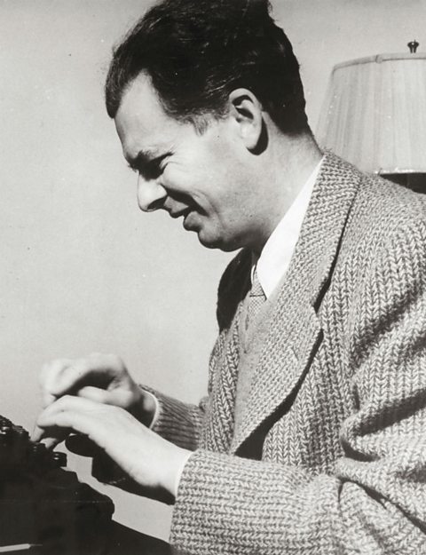 Aldous Huxley typing on a typewriter