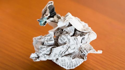 Crumpled newspaper on a table