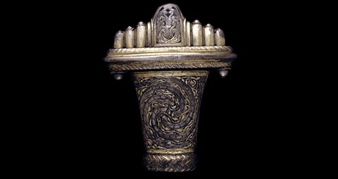 A decorated sword handle.