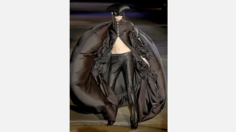 Steve Wood/REX The famous black parachute cape from McQueen's Supercalifragilisticexpialidocious collection (Credit: Steve Wood/REX)
