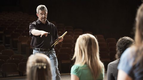 A director leads a rehearsal