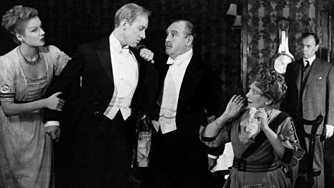 Photo from British premiere of An Inspector Calls.  Mr and Mrs Birling are shocked by Eric's confession.