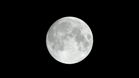 A full moon in the night sky