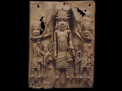  A brass plaque showing an Oba with his attendants. 